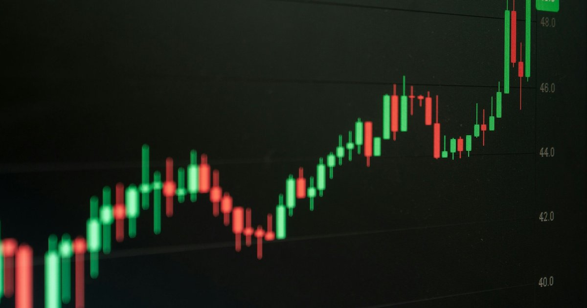 Stock chart indicates growth and potential profit.